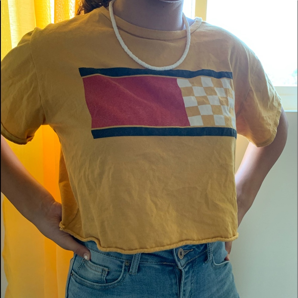 gold crop top with/ checkered patterns.